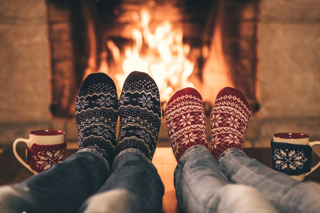 Couple inside Luxury Holiday Homes at their fire place